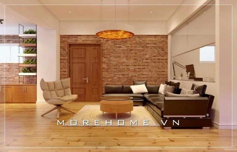 Bộ sofa bọc da màu tối kết hợp với gam màu tổng thể của ngôi nhà tạo nên 1 không gian sống cực kỳ ấn tượng.